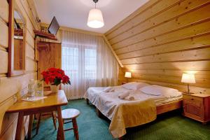 Posteľ alebo postele v izbe v ubytovaní Góralski Gościniec & SPA