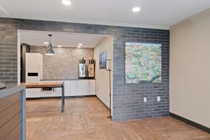 a kitchen with a brick wall at Extended Stay America Suites - San Francisco - San Mateo - SFO in San Mateo