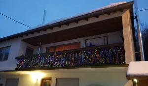 a balcony with christmas lights on a house at Pfötchen in Mettweiler