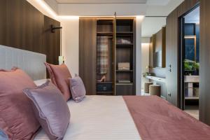 Postel nebo postele na pokoji v ubytování We Me Suite Hotel