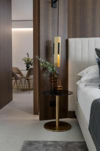 Postel nebo postele na pokoji v ubytování We Me Suite Hotel