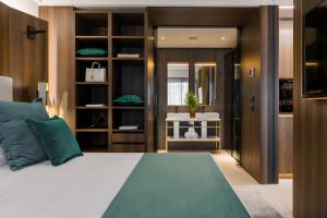Postel nebo postele na pokoji v ubytování We Me Suite Hotel