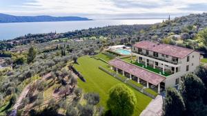 an aerial view of a large house on a hill at Relais Zenner in Toscolano Maderno