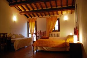 Posteľ alebo postele v izbe v ubytovaní Agriturismo Camiano Piccolo
