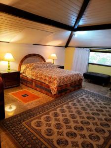 Ein Bett oder Betten in einem Zimmer der Unterkunft Casa Fazenda Inglesa Petrópolis RJ