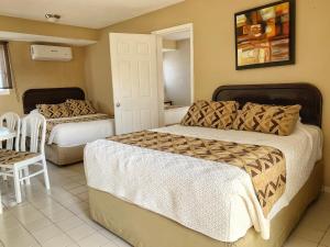 Postel nebo postele na pokoji v ubytování Hotel Santa Fe Los Cabos by Villa Group
