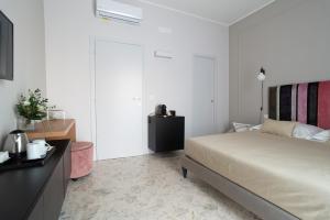 Postel nebo postele na pokoji v ubytování Casa Almika Sparano