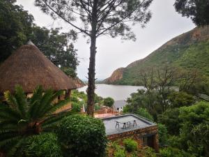 a view of a house with a view of a lake at Metsing at Harties in Hartbeespoort