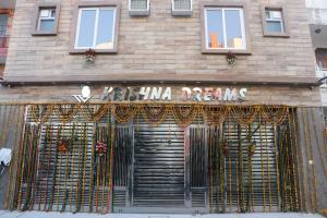 a store with a gate in front of a building at Krishna Dreams in Haridwār
