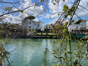 a view of a river with buildings in the background at Villa Louise-Rose in Villeneuve-Loubet