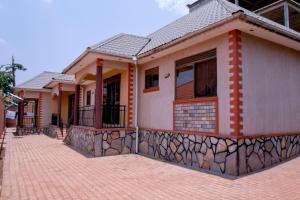a row of houses on a brick street at Seguku Katale Apartment 2 in Kampala