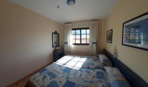 Postel nebo postele na pokoji v ubytování SUNSET HOUSE EL Cieno 10A