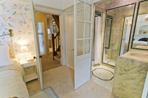 a bathroom with a shower and a sink in a room at Bay House in Beaumaris +21 photos