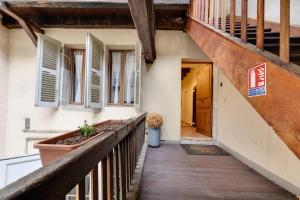 a hallway of a house with a wooden walkway at La Cour Filaterie - Suite of 30 sq m in the Annecy breakfast included in Annecy