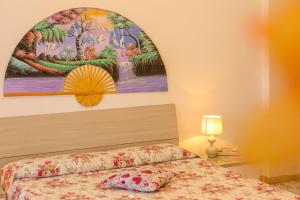 Postel nebo postele na pokoji v ubytování Mini Hotel Rendez Vous