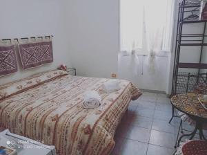 Postel nebo postele na pokoji v ubytování I colori di Iglesias