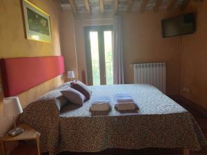 Postel nebo postele na pokoji v ubytování Dolce Vita in Tuscany B&B