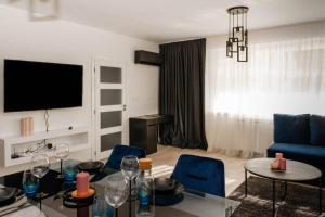 A television and/or entertainment centre at Maison Lux