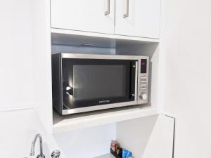 A kitchen or kitchenette at Casa Nostra Motel Mackay