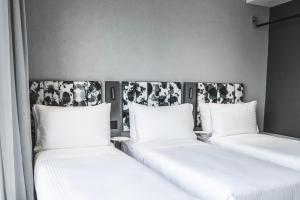 Ein Bett oder Betten in einem Zimmer der Unterkunft Page148, Page Hotels