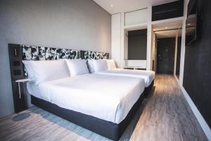 Ein Bett oder Betten in einem Zimmer der Unterkunft Page148, Page Hotels
