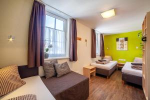 Ένα ή περισσότερα κρεβάτια σε δωμάτιο στο Rutsche Hostel