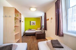 Ένα ή περισσότερα κρεβάτια σε δωμάτιο στο Rutsche Hostel