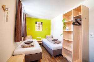 Ένα ή περισσότερα κρεβάτια σε δωμάτιο στο Rutsche Hostel