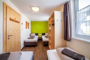 Ένα ή περισσότερα κρεβάτια σε δωμάτιο στο Rutsche Hostel