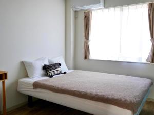 Llit o llits en una habitació de Guesthouse Koa