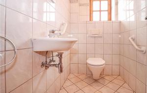 a white bathroom with a sink and a toilet at Beautiful Home In Ebbs With House A Panoramic View in Rettenschöss