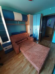 a couch in a room with a bunk bed at Трёхкомнатные апартаменты in Kryvyi Rih +6 photos