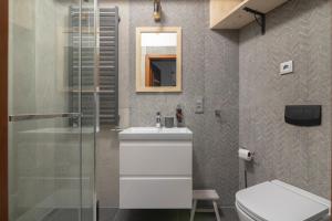 Kúpeľňa v ubytovaní Apartamenty Domino - Kościelisko