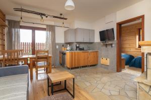 Kuchyňa alebo kuchynka v ubytovaní Apartamenty Domino - Kościelisko