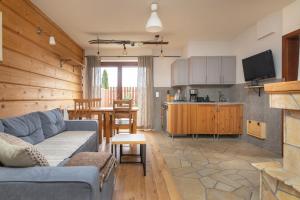 Kuchyňa alebo kuchynka v ubytovaní Apartamenty Domino - Kościelisko