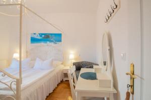 Un pat sau paturi într-o cameră la Hotel Villa Vera