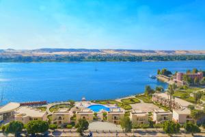 a large body of water with a large building at Tolip Aswan Hotel in Aswan