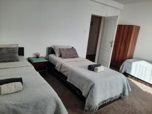 Giường trong phòng chung tại Miido Apartments