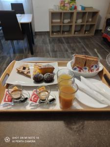 a tray with different types of food on a table at La Porta dell'Alcantara in Gaggi