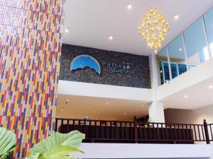 a lobby of a building with a colorful wall at Pattaya Blue Sky in Pattaya