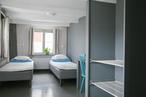 Tempat tidur dalam kamar di Visby Logi & Vandrarhem