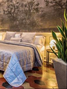 Postel nebo postele na pokoji v ubytování B&B PISTOIA INN