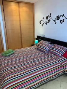 Postel nebo postele na pokoji v ubytování Adeje Paradise en Playa Paraiso