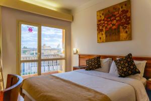 Ένα ή περισσότερα κρεβάτια σε δωμάτιο στο Hotel Royal Marshal