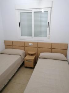 Postel nebo postele na pokoji v ubytování APCOSTAS Torremar - Oropesa