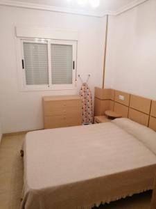 Postel nebo postele na pokoji v ubytování APCOSTAS Torremar - Oropesa