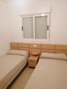 Postel nebo postele na pokoji v ubytování APCOSTAS Torremar - Oropesa