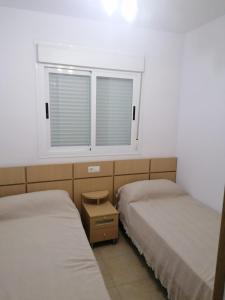 Postel nebo postele na pokoji v ubytování APCOSTAS Torremar - Oropesa