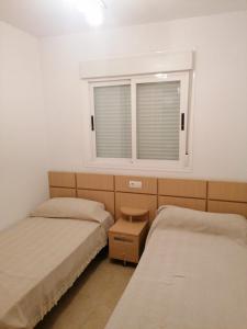 Postel nebo postele na pokoji v ubytování APCOSTAS Torremar - Oropesa