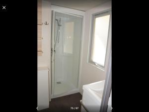 a bathroom with a shower and a toilet and a sink at Best Holiday Port Grimaud in Grimaud
